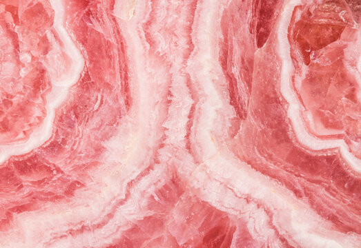Detailed close-up of pink Rhodochrosite stone pattern