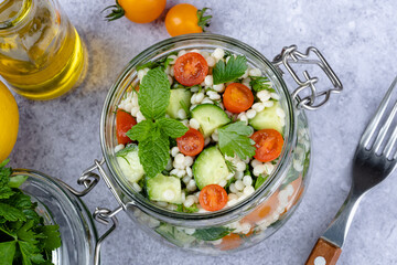 Tabbouleh salad national traditional food middle eastern. Healthy vegetarian food. Muslim family dinner, Ramadan, iftar. Arabian cuisine. top view