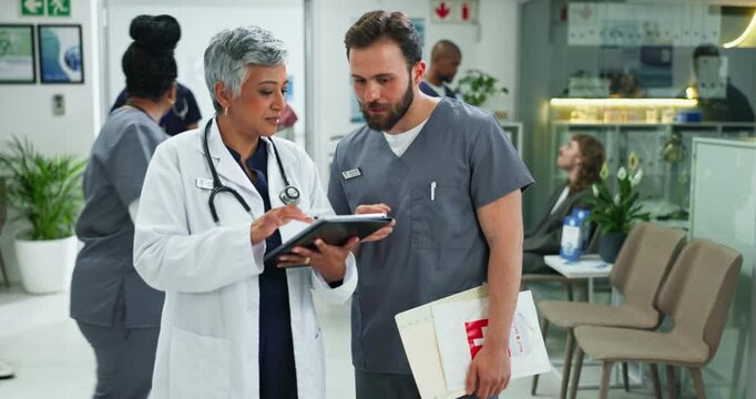 Tablet, team and doctor with nurse for conversation, people planning or help intern in hospital. Technology, medical collaboration and talk to happy surgeon for training, meeting or healthcare advice