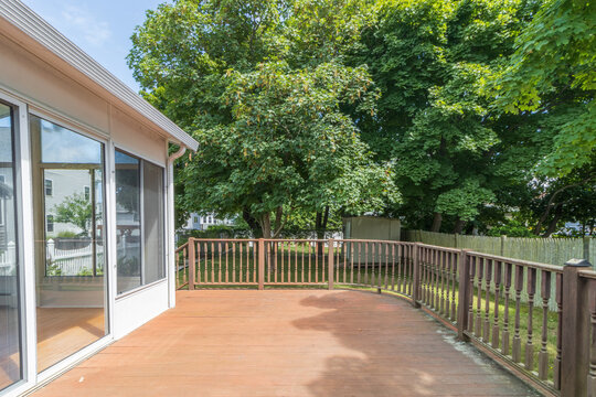 spacious deck overlooking backyard woods