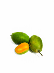 Fresh green mango with cut in half on isolated white background 