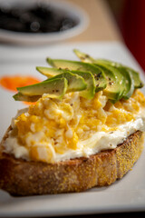 bread with cheese and herbs and avocado