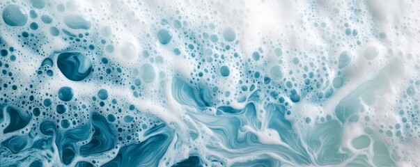 Naklejka premium Abstract blue and white soap foam texture, close-up. Cleaning and purity concept