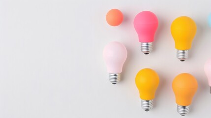 Colorful light bulbs arranged on white background, pastel tones, creative and bright flat lay design, modern minimal aesthetic, vibrant and playful concept for innovation and ideas


