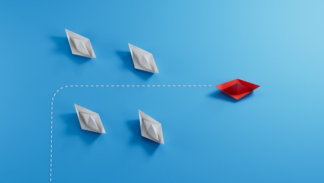 Change Group of paper boat change disruptive in one direction and with one individual pointing in the different way. Business concept for change new ideas creativity and innovative solution disrupt