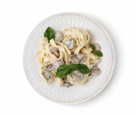Delicious pasta with mushrooms and basil isolated on white, top view
