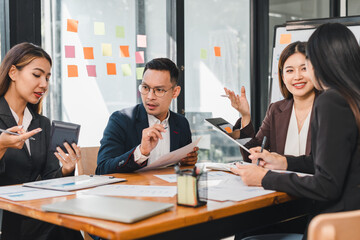 group of professionals engaged in collaborative meeting, discussing strategies and analyzing data. atmosphere is focused and dynamic, showcasing teamwork and communication