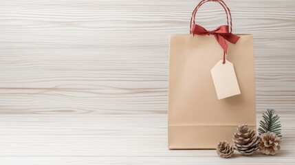 Eco-friendly gift bag with blank tag and festive pinecones on wooden background