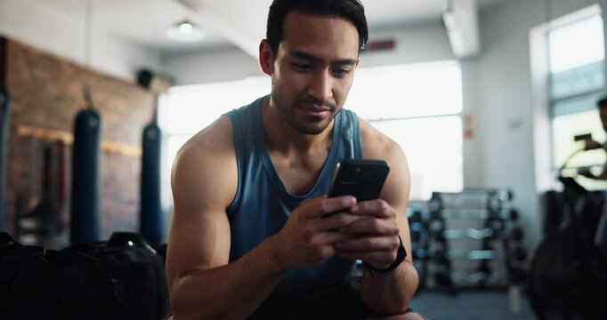 Man, gym and happy with smartphone for fitness on social media, networking and communication. Male person, body builder and laugh or smile on internet for funny videos, memes and entertainment