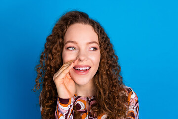 Photo of lovely young lady share secret cover mouth look empty space dressed stylish colorful...