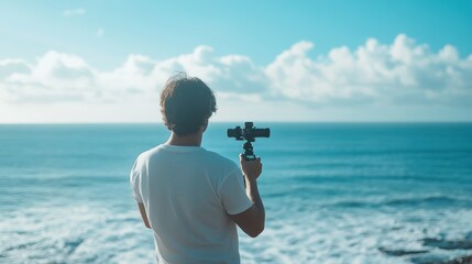 Obraz premium Man filming the Ocean