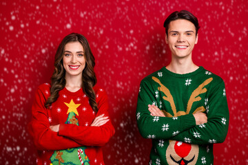 Photo of two cheerful positive people toothy smile crossed arms isolated on red color background