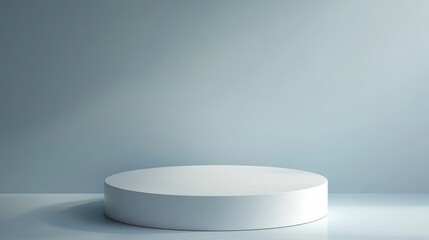 A White Cylindrical Platform Against a Light Blue Background
