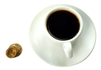 Cup of coffee and some coins piled and  
