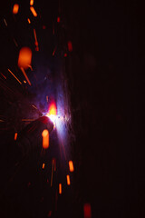 A bright flash of light and a sheaf of sparks in a cloud of smoke. Miniature Universe. Design...