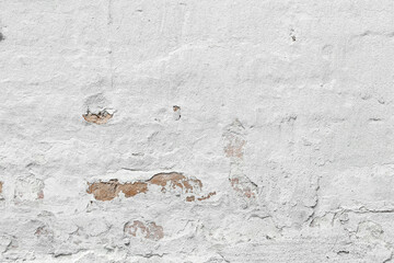 White shabby grungy brick wall. Free space for an inscription. Can be used as a background or poster. Fragment of a red brick wall with bumps and textured plaster.	
