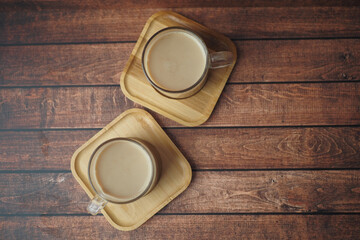An Elegant Coffee Setup on a Beautifully Crafted Wooden Table for a Cozy Atmosphere
