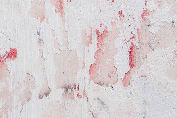 White texture of a concrete wall with natural relief and damage in the form of chips and scratches. Fragment of an old stone surface with a crack. Dark rough surface with a place for text.