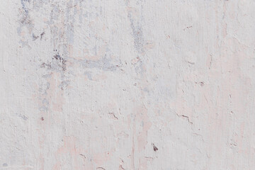 White texture of a concrete wall with natural relief and damage in the form of chips and scratches. Fragment of an old stone surface with a crack. Dark rough surface with a place for text.