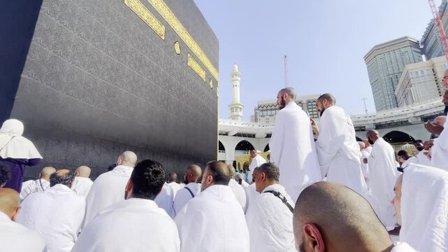 A muslim people praying at the masjidil haram mosque or kaaba