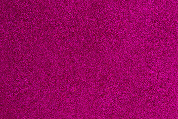 A close up of a pink background with a lot of glitter