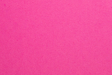 A pink background with a white dot in the middle, textured origami paper backdrop