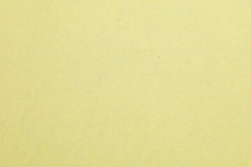 Fototapeta premium A yellow background with a white object in the middle, textured origami paper backdrop
