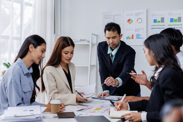 Asian business people working together in the office, Young asian people at business meeting.
