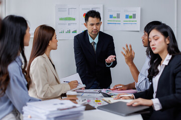 Asian business people working together in the office, Young asian people at business meeting.
