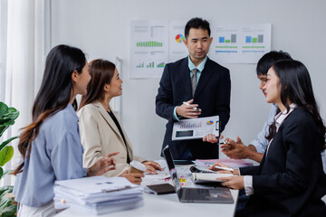 Asian business people working together in the office, Young asian people at business meeting.
