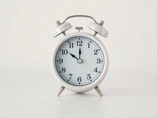 Vintage white alarm clock on a light background symbolizing time simplicity elegance, white, time