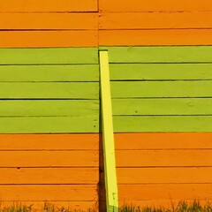 Vibrant Orange and Green Wooden Wall with Vertical Plank in Minimalist Composition
