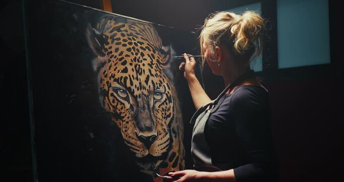 Woman Painting Portrait of a Leopard