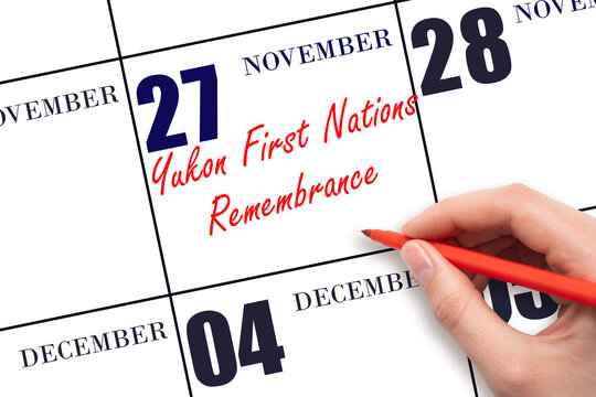 November 27. Hand writing text Yukon First Nations Remembrance on calendar date. Save the date.