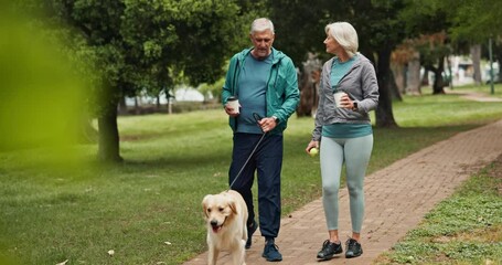 Senior couple, dog and walking in park with coffee, care and love in morning with smile for chat. Mature man, woman and pet animal with conversation, drink or exercise on path for wellness in England