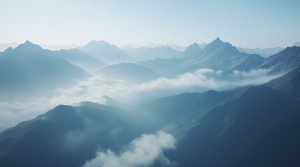 Fototapeta premium Majestic Mountain Panorama with Misty Clouds at Dawn - A Serene Aerial View