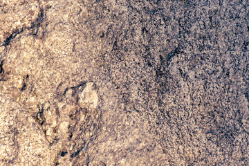 granite rock surface as natural background. Rough raw stone texture. Unique exclusive nature material. 