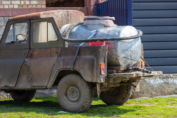 old soviet 4x4 converted to a pickup with barrel for small farmers milk collection and reselling it...