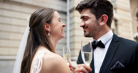 Wedding, cheers and couple in city with champagne at ceremony, celebration and commitment. Romance, alcohol toast and man and woman laughing together in town for promise, partnership and marriage