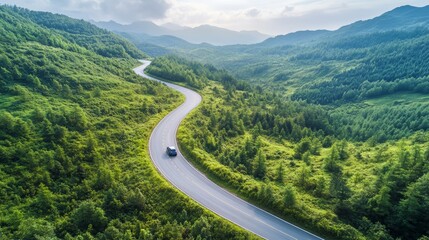 Aerial view of scenic mountain road green forest with car on asphalt road Zero Carbon Emission and Environmental Care Concept Nature balance with people life exploration and travel rural path way