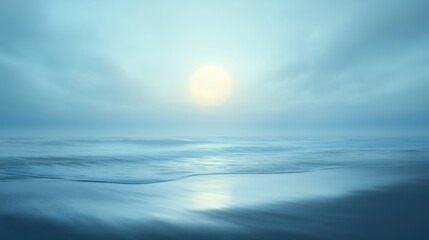 Obraz premium Mystic Horizon: The vast ocean stretches endlessly, meeting a hazy sky where the sun casts a serene glow. A soft mist blankets the scene, creating a tranquil atmosphere.