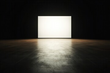 A minimalistic scene featuring a blank white screen illuminated in a dimly lit room, emphasizing simplicity and space.