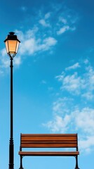 A street lamp is lit up in front of a bench