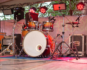 An international drum set is placed on the concert stage.