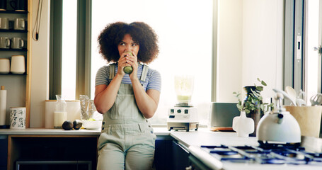 House, drinking and woman with green juice in kitchen, nutrition and protein supplement. Apartment,...