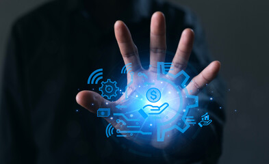 A hand is holding a blue screen with a dollar sign and other icons. Concept of technology and...