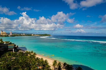 Breathtaking View of Tumon Bay with Clear Blue Waters and Palm Trees in Guam