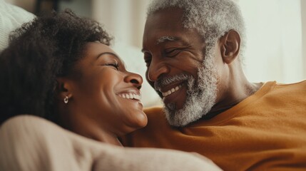 Senior couple enjoying a peaceful morning in bed, smiling warmly at each other