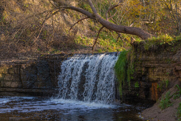 Sablinsky waterfall on the Sablinka river on a October day. Leningrad region, Russia