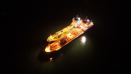 Night shots of cargo ships settled in the harbor taken by a DJI mini 4 pro
